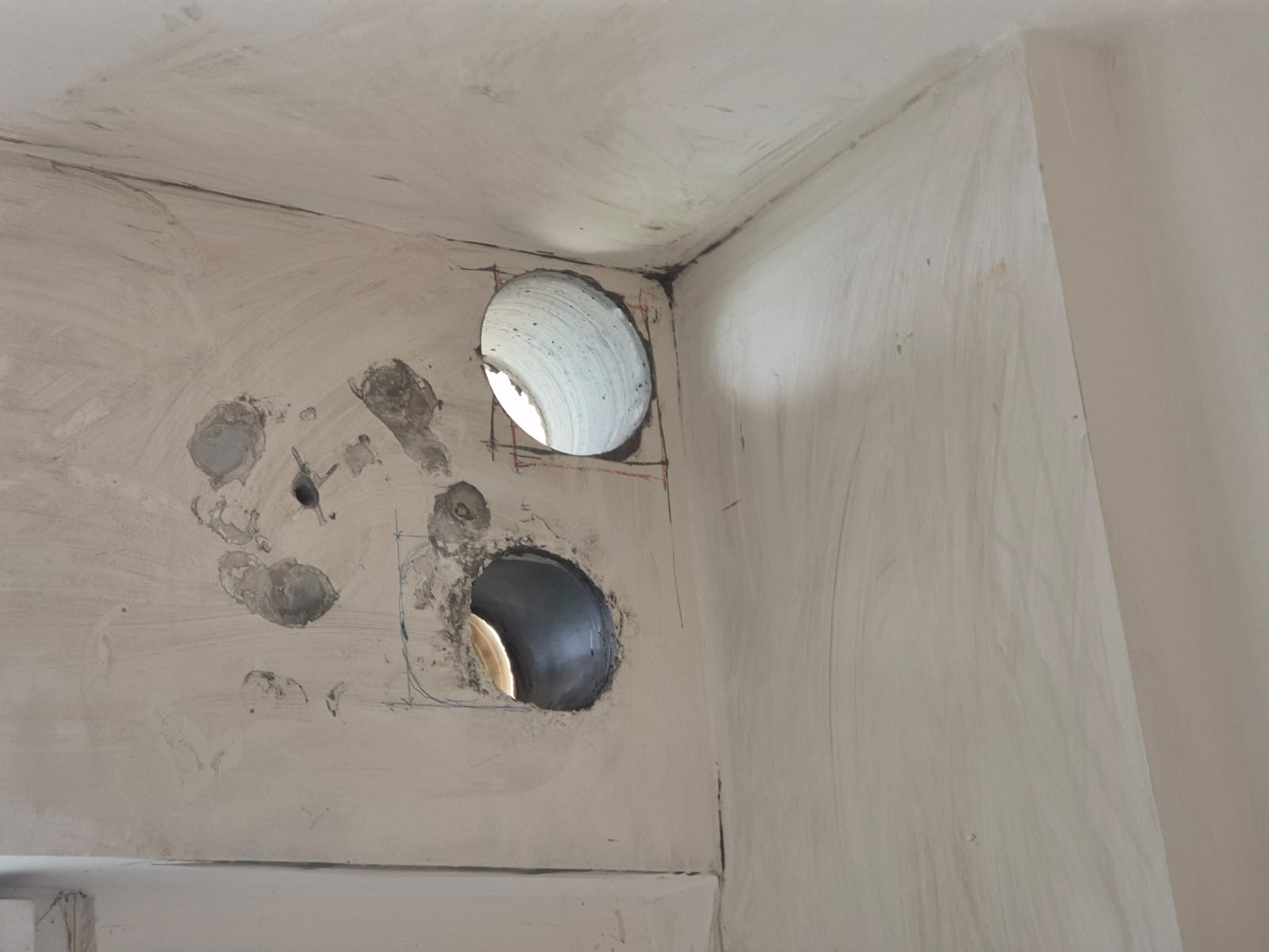 Twin duct holes through a finished ceiling